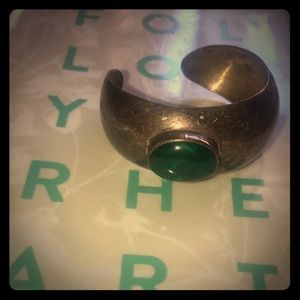 Silver bangle with green stone